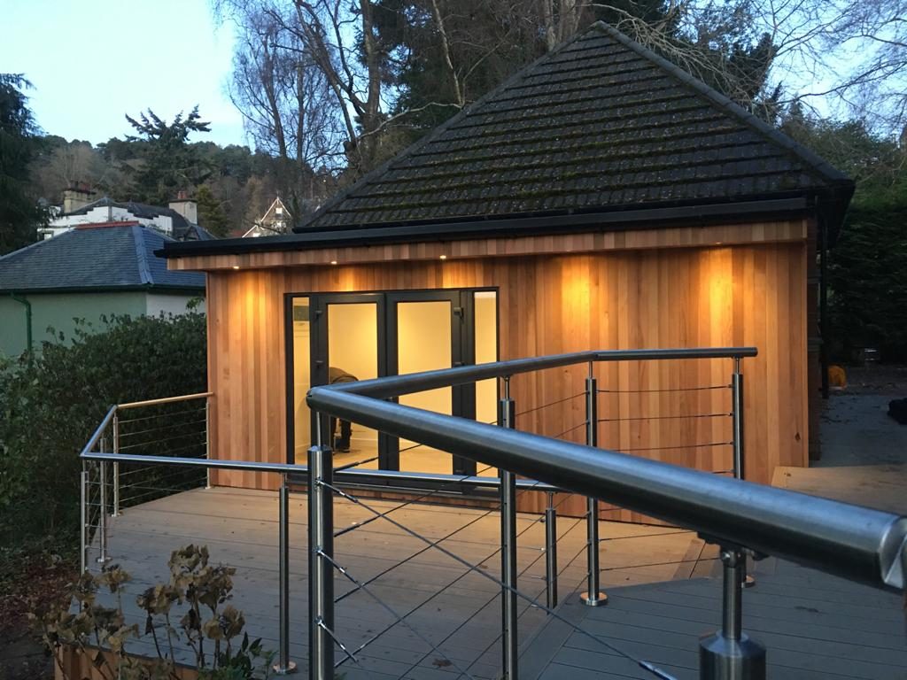 garden room with deck and balustrade